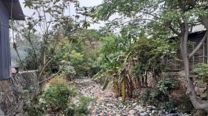 Sampah Menumpuk Lagi di Kali Bahagia, Pembersihan Terkendala Bangunan Liar