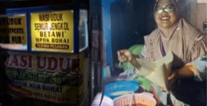 Mpok Nur Bohai dan Nasi Uduk Semur Jengkol, Resep Warisan Selamatkan Ekonomi Keluarga